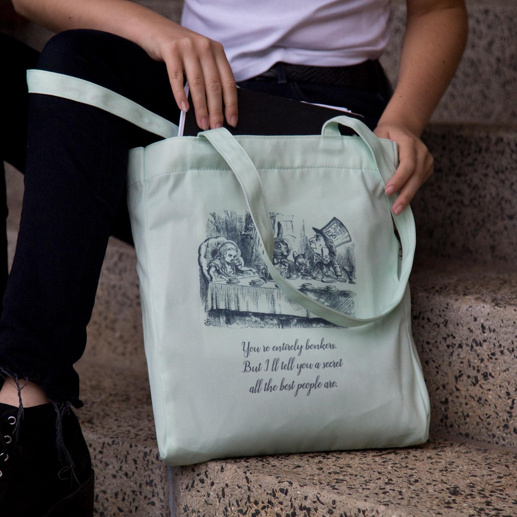 Alice's Adventures in Wonderland Green Tote Bag by Lewis Carroll featuring Alice and Cheshire Cat design, by Well Read Co. - Opneing Bag