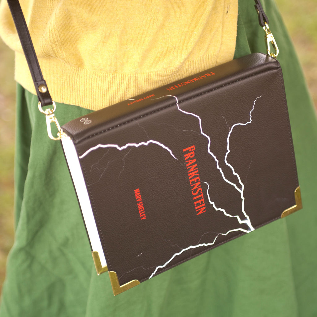 Frankenstein Black Handbag by Mary Shelley featuring White Lightning Strikes design, by Well Read Co. - Model Standing