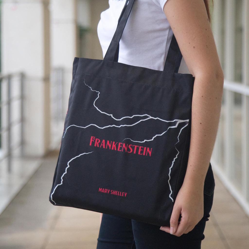 Frankenstein Black Tote Bag by Mary Shelley featuring Lightning Flash design, by Well Read Co. - Standing