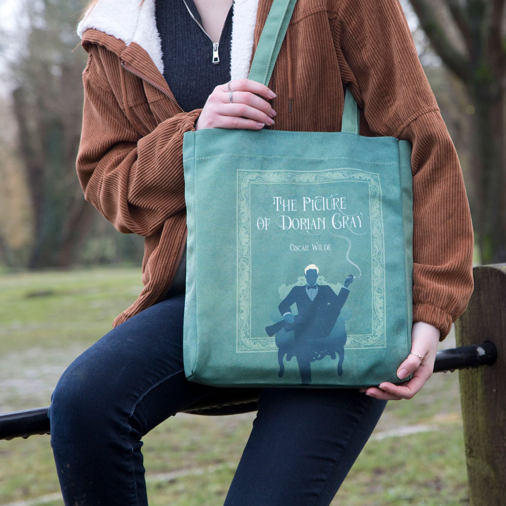 The Picture of Dorian Gray Blue Tote Bag by Oscar Wilde featuring Gentleman and Cigar design, by Well Read Co. - Model Sitting